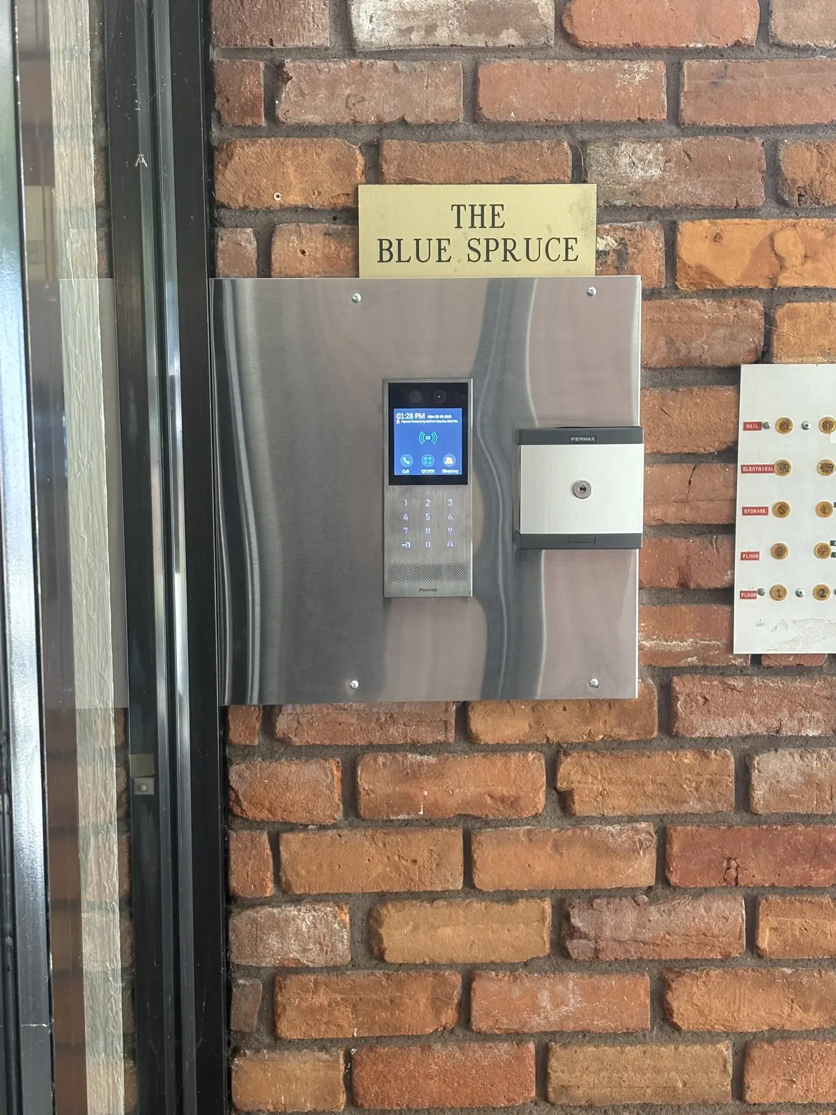 Akuvox video intercom and access-control terminal installed at Blue Spruce in White Rock
