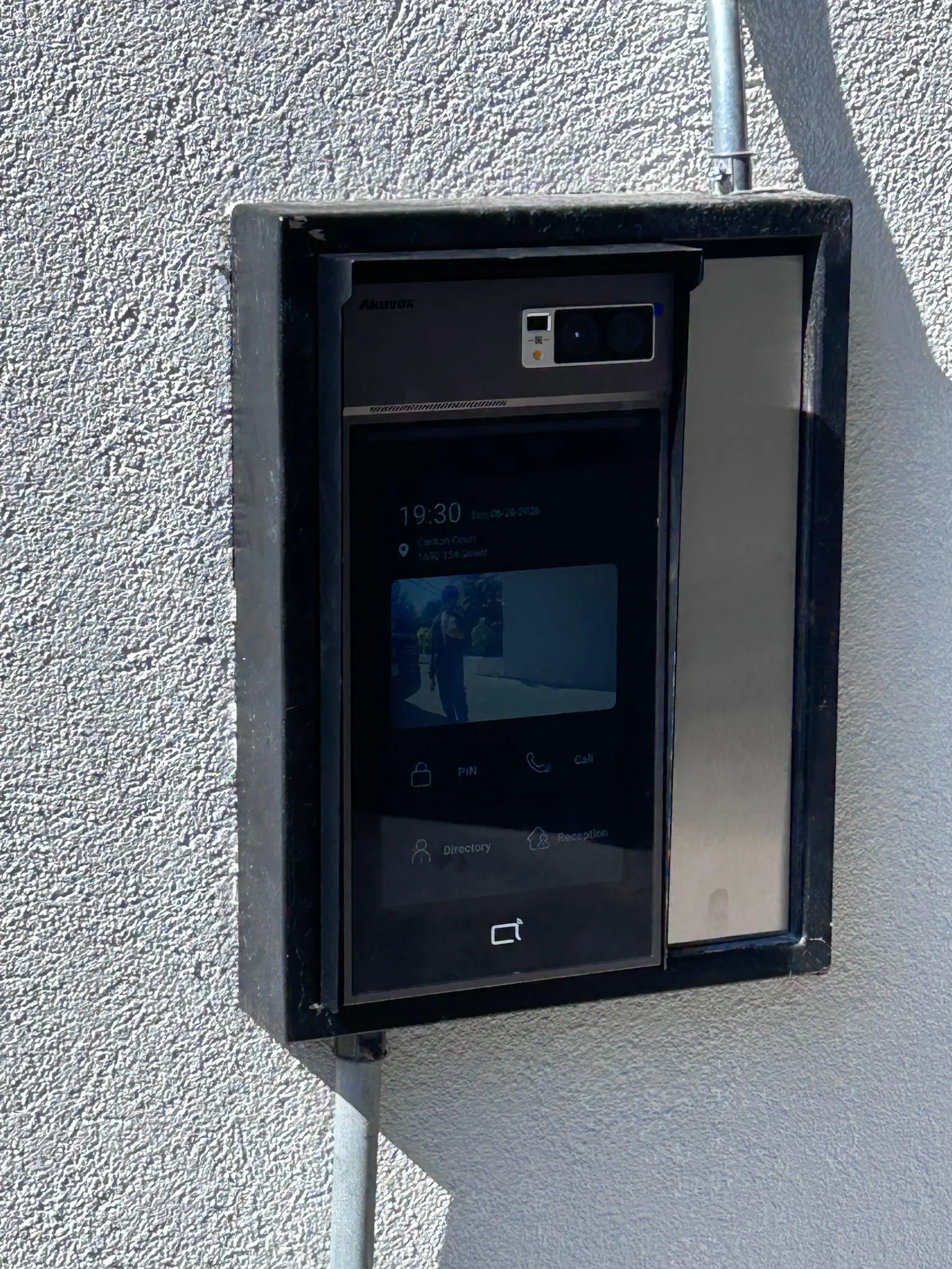 After photo of the Akuvox video intercom installed at Carlton Court in Surrey for live video calling and smart access
