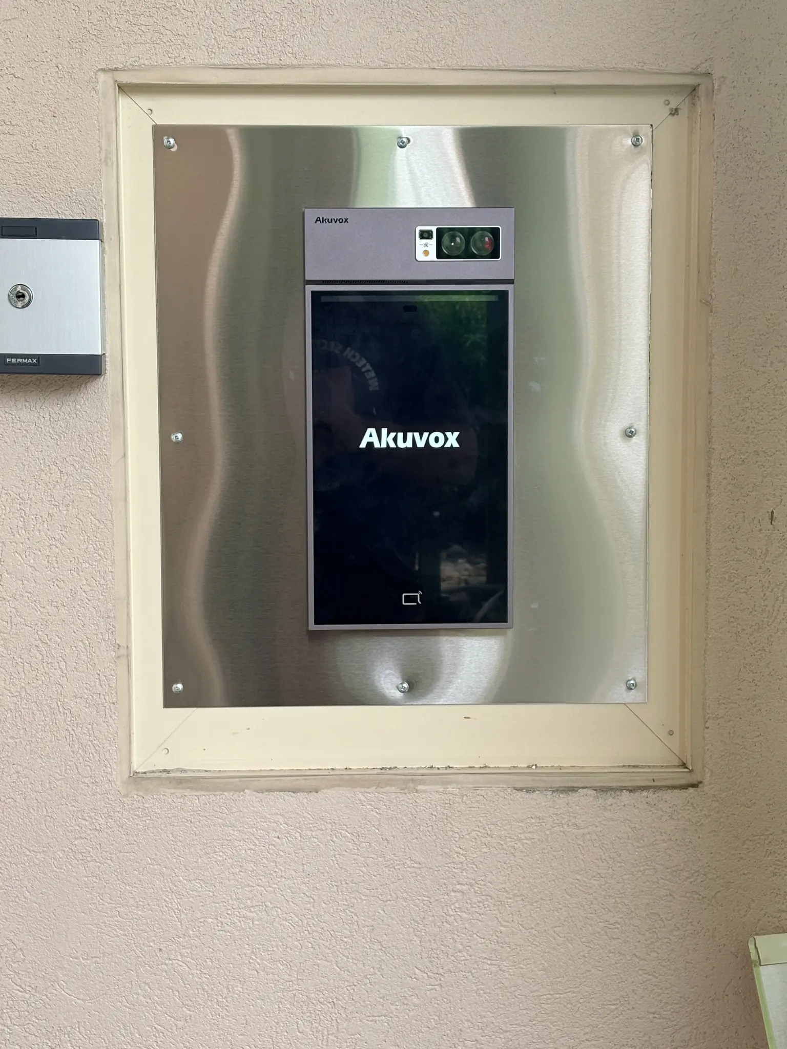 Akuvox S539 video intercom on a custom stainless-steel retrofit plate at Chelsea Gardens Surrey