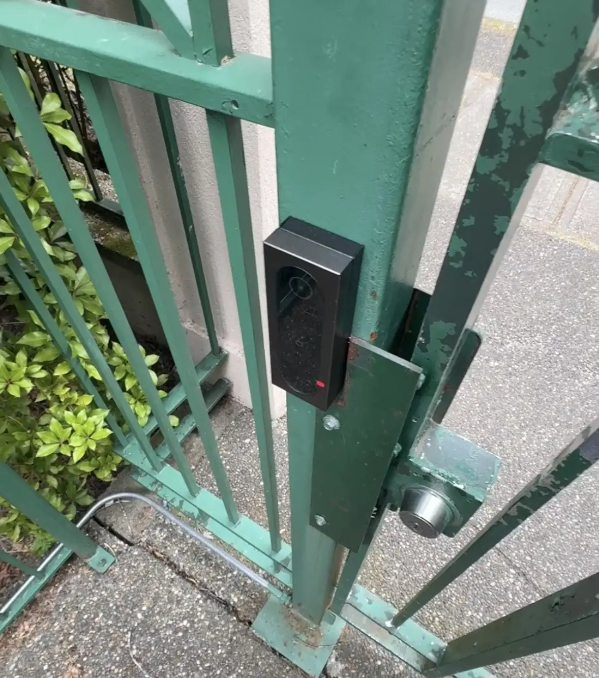 Akuvox A08 access-control reader installed on an exterior gate at Chelsea Gardens in Surrey