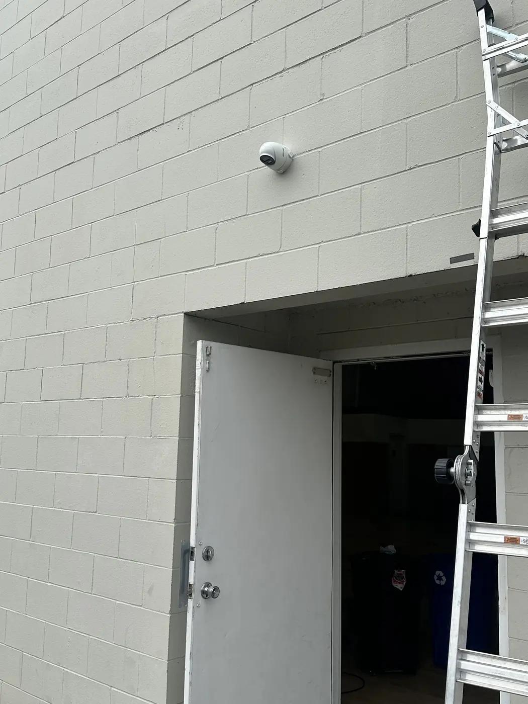 Clean Hikvision exterior camera installation at DRIVE Basketball with no exposed wiring