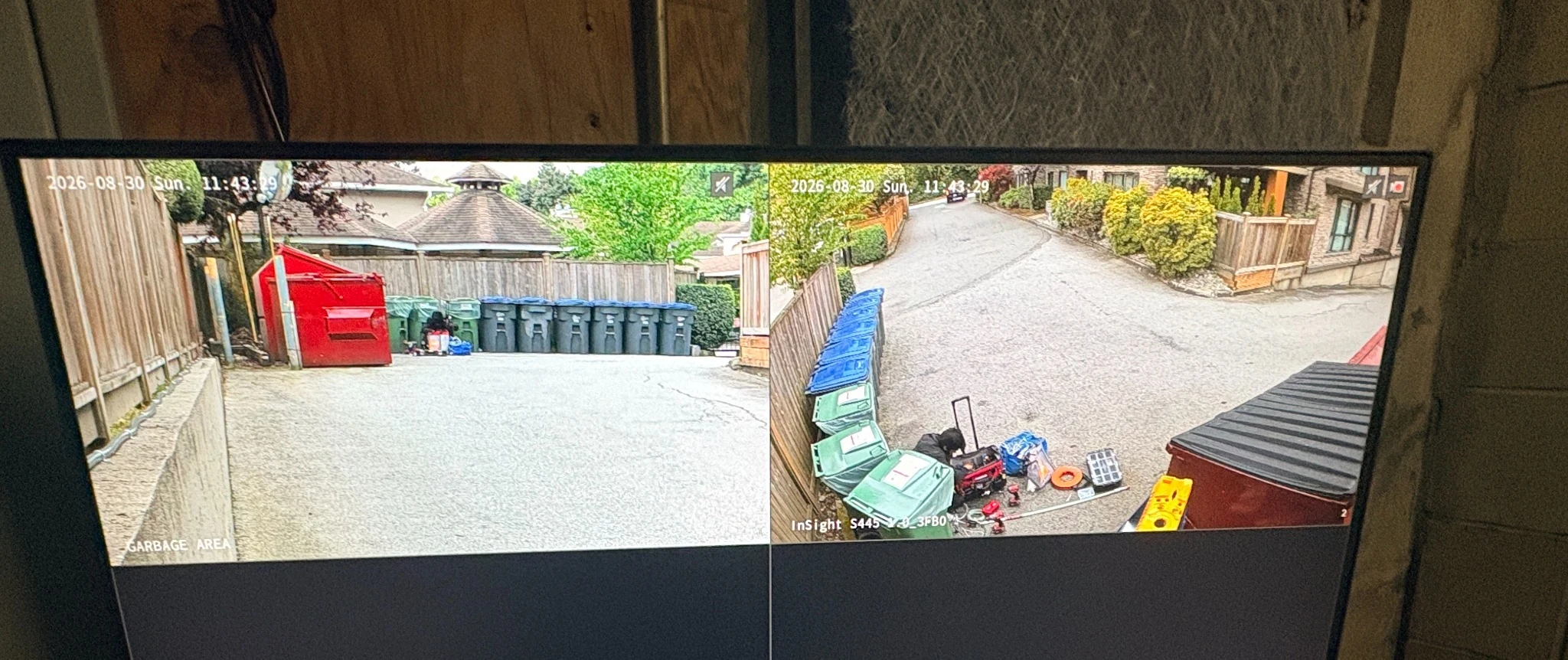 Two live CCTV views of the garbage and recycling area and adjoining approach at Highpoint Gardens in Guildford