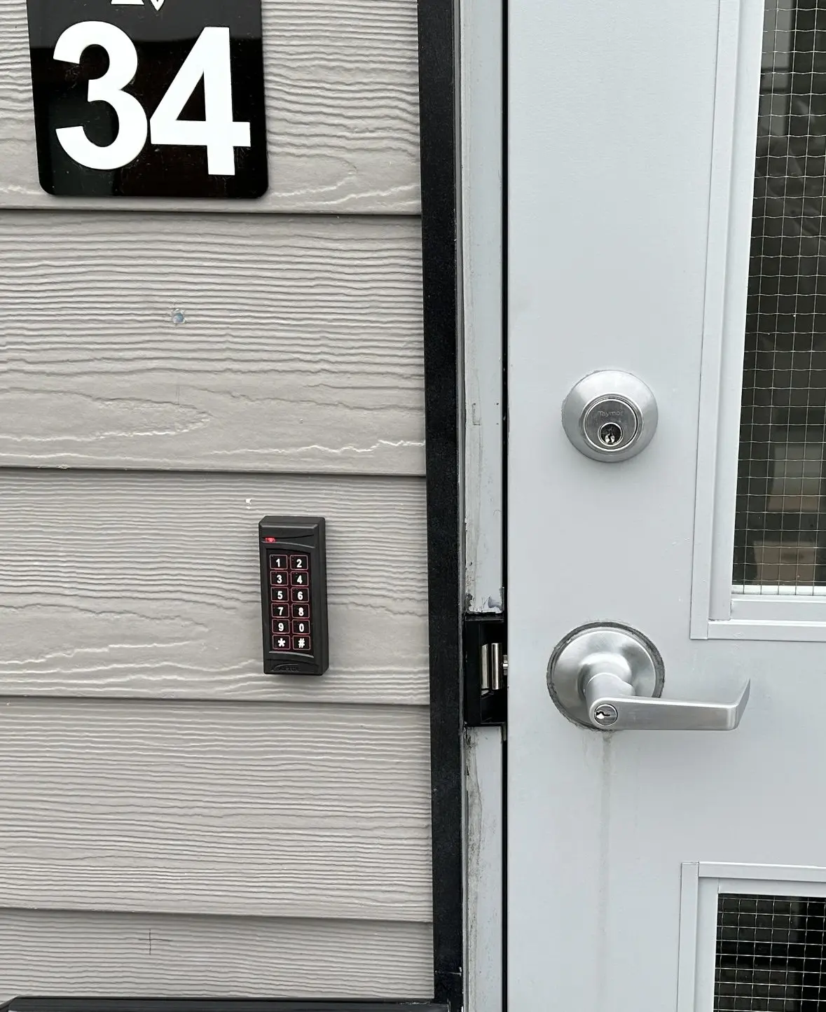 Kantech keypad and credential reader installed beside a controlled door at Horizon in Surrey